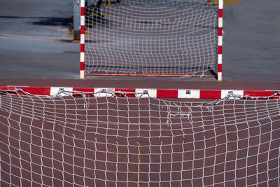 Close-up of empty chairs against brick wall