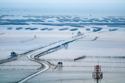 High angle view of railroad tracks against sky during winter