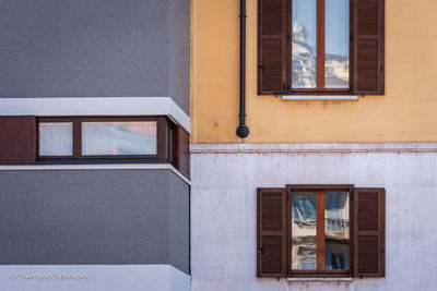 Low angle view of window on wall of building