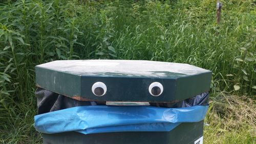 High angle view of plastic container on field