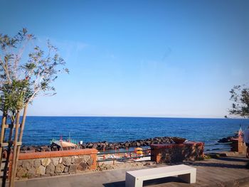 Scenic view of sea against clear blue sky