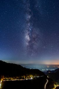 Scenic view of star field against sky at night