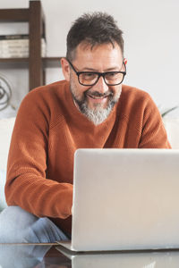 Man using laptop at home