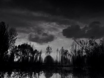 Scenic view of lake against cloudy sky