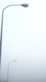 Low angle view of street light against clear sky