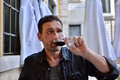 Portrait of man drinking glass