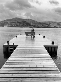 Pier on sea against sky