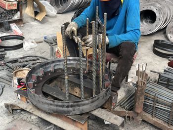 Low section of man working at construction site