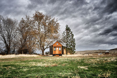 House on landscape against sky