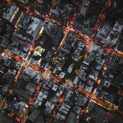 Aerial view of illuminated city at night