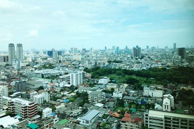 High angle view of buildings in city against sky