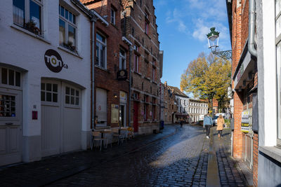 Street amidst buildings against sky