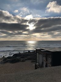 Scenic view of beach against sky during sunset