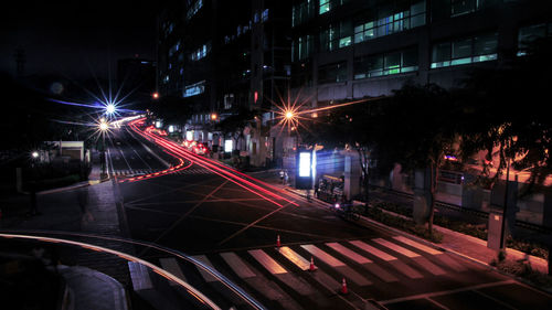 Light trails on city street at night