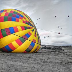 Multi colored hot air balloons flying in sky