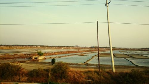 Electricity pylons on countryside landscape