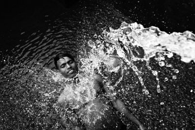 Portrait of young man swimming in sea