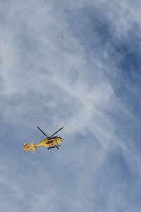 Low angle view of airplane against sky