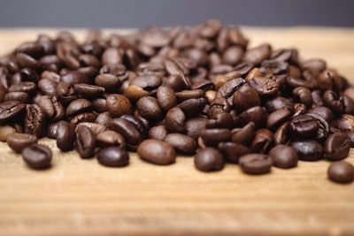 Close-up of coffee beans on table
