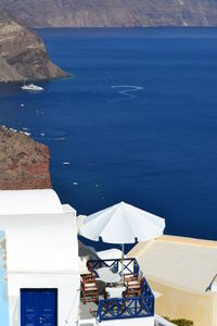 High angle view of buildings by sea at santorini island