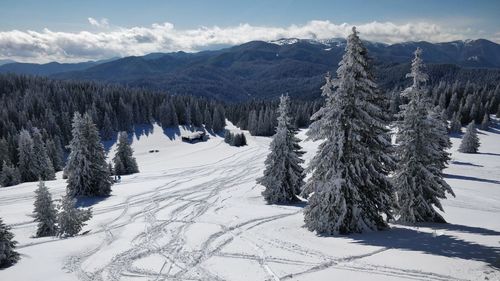 Scenic view of mountains against sky during winter