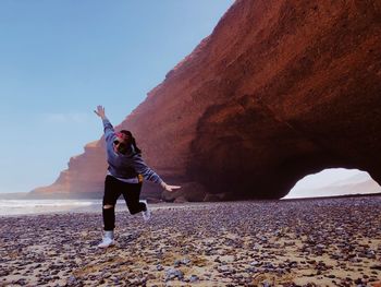 Full length of man standing on rock