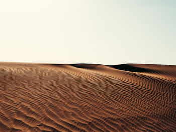 Scenic view of desert against clear sky