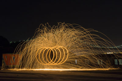 Light trails against sky at night