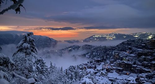 Aerial view of townscape against sky during winter