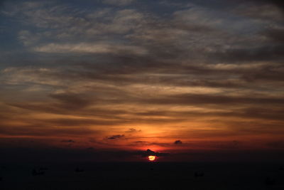 Scenic view of sea against romantic sky at sunset