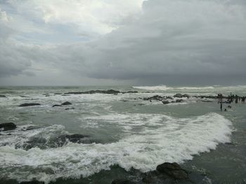 Scenic view of sea against cloudy sky