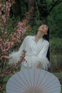 Portrait of young woman with umbrella