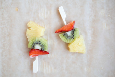 Directly above shot of chopped fruit on table