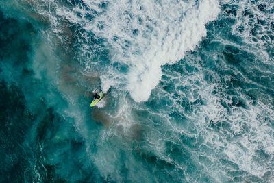 Aerial view of person surfing on sea