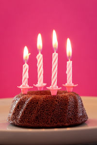 Burning candles on birthday cake