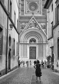 Group of people walking in front of building