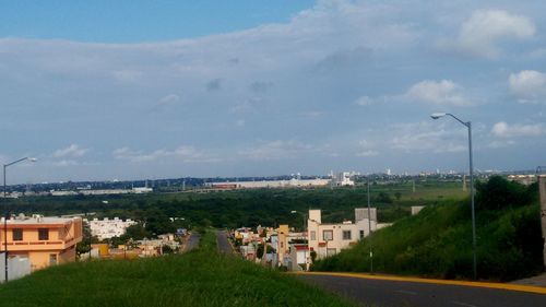 Houses in town against sky