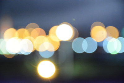 Low angle view of illuminated lights at night