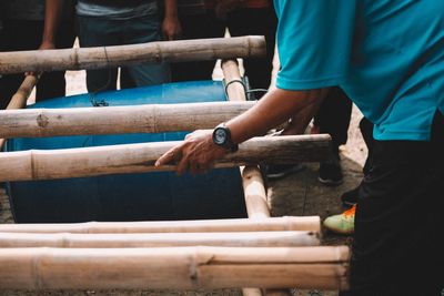 People making barrel raft