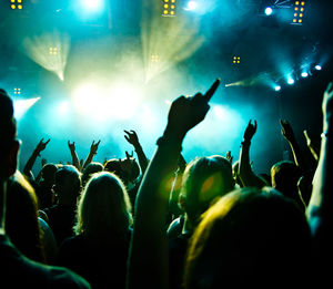 Crowd enjoying at music concert at night