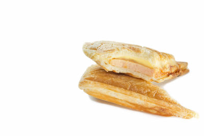 Close-up of bread against white background