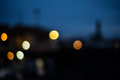 Defocused image of illuminated lights at night