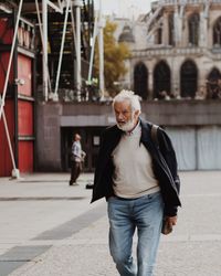 Full length of woman standing in city