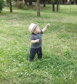 Full length of boy in grass