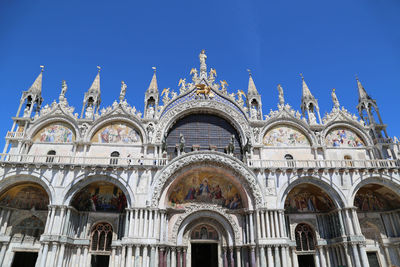 Low angle view of building against blue sky