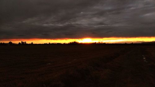 Scenic view of sunset over land