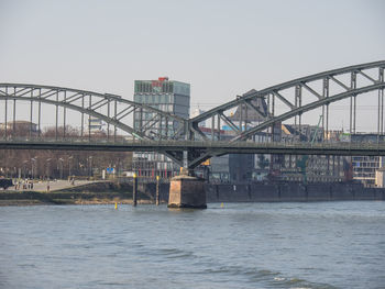 Bridge over river against clear sky