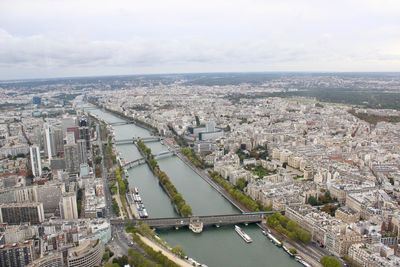 High angle view of river amidst buildings in city