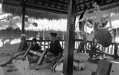 Group of people sitting on floor