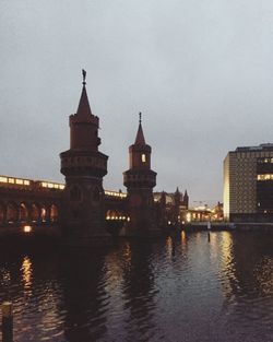 Reflection of illuminated buildings in city at night